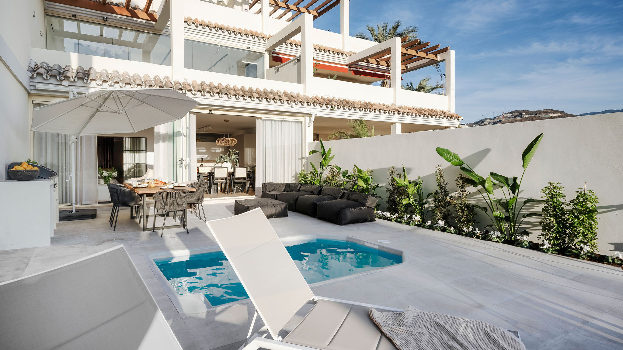 Luxurious Four-Bedroom Apartment with Private Pool and Garden in Nueva Andalucia: Modern Parisian Haven for Sale"