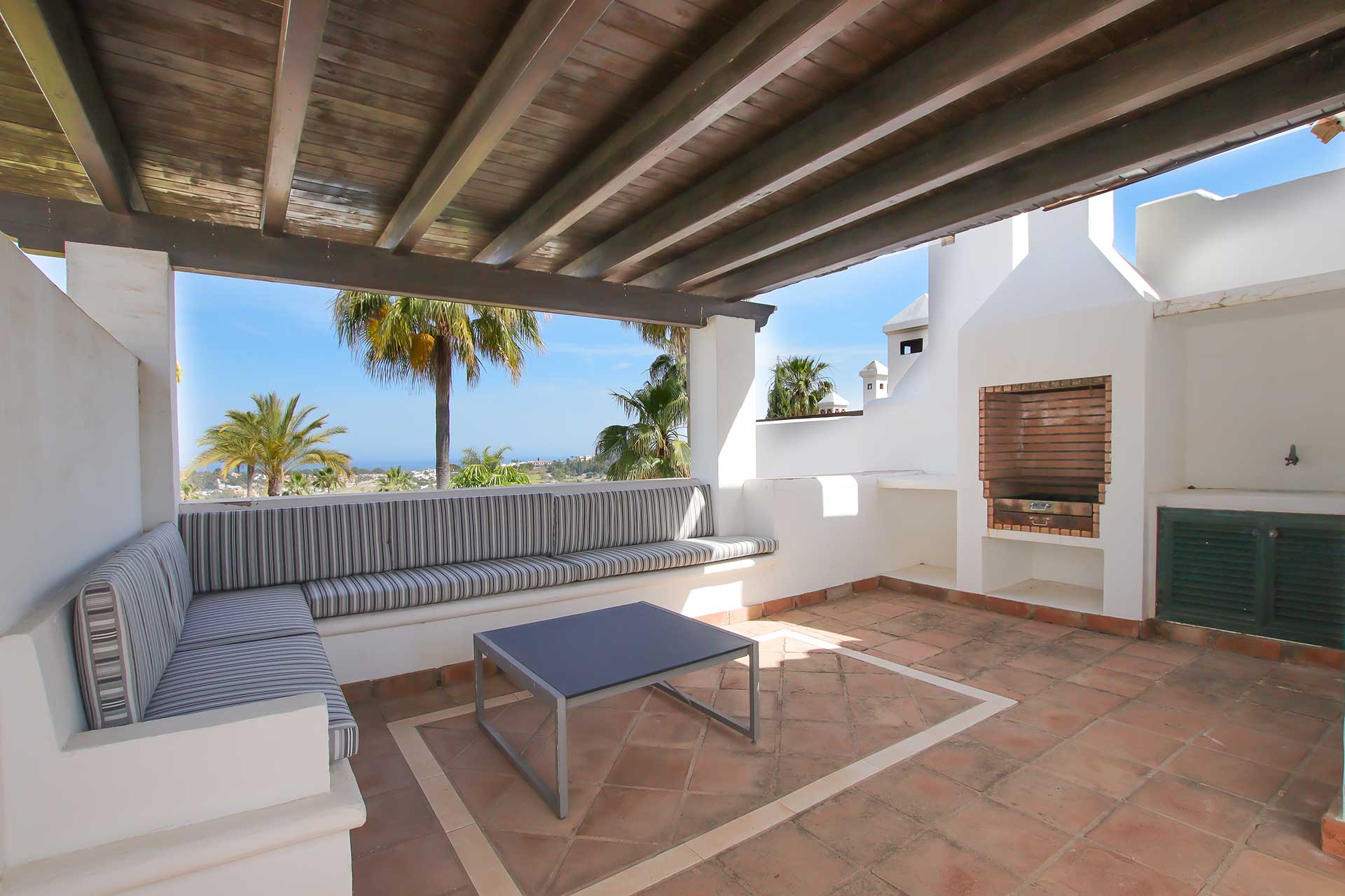Roof terrace offers unparalleled panoramic views of the surrounding landscape, including the lush communal gardens, the sparkling swimming pool, and the glistening Mediterranean Sea.