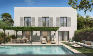 A modern villa featuring a pool, outdoor seating area, and greenery in Las Villas de los Álamos