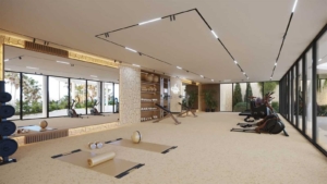 Modern gym with large windows and natural light at Altezza Suites Estepona.