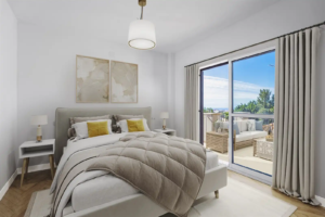 Stylish master bedroom in an Olimpo Mijas villa with a private terrace.