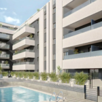 Luxury apartment complex Premier Residencial Mijas with balconies and a pool.