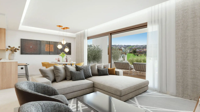 Contemporary living and dining area at The Meadows Mijas overlooking the golf course.