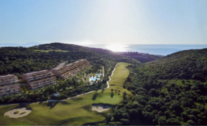 Sunset view of Atria F1 residences with golf course and sea in the background