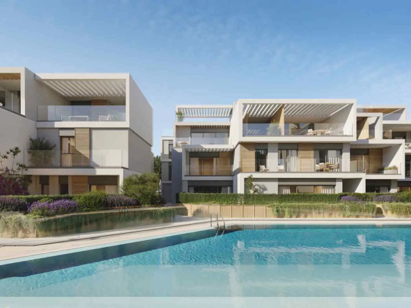 Daytime pool view at Isla Bela Marbella with surrounding modern residences.