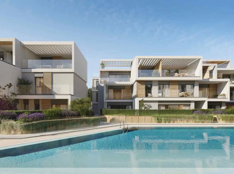 Daytime pool view at Isla Bela Marbella with surrounding modern residences.