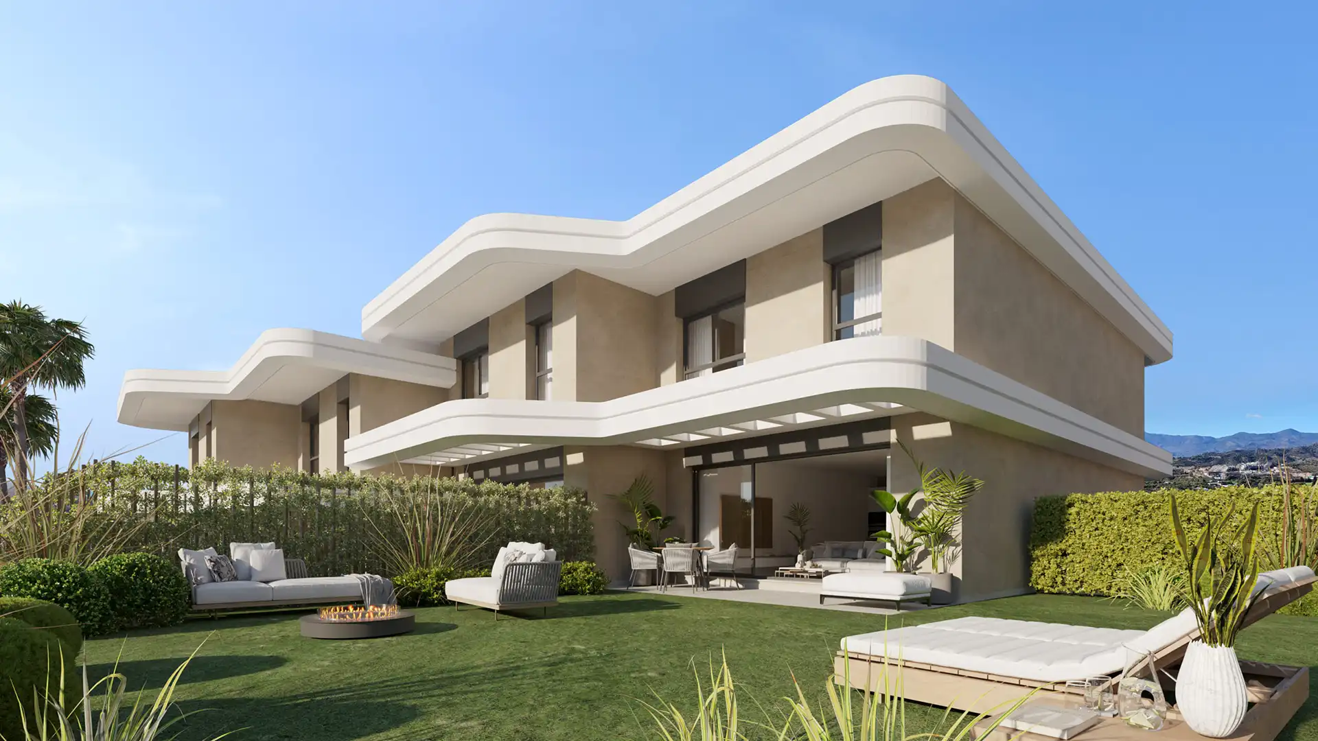 Private garden and terrace of a townhouse at Adagio Estepona with modern outdoor furniture