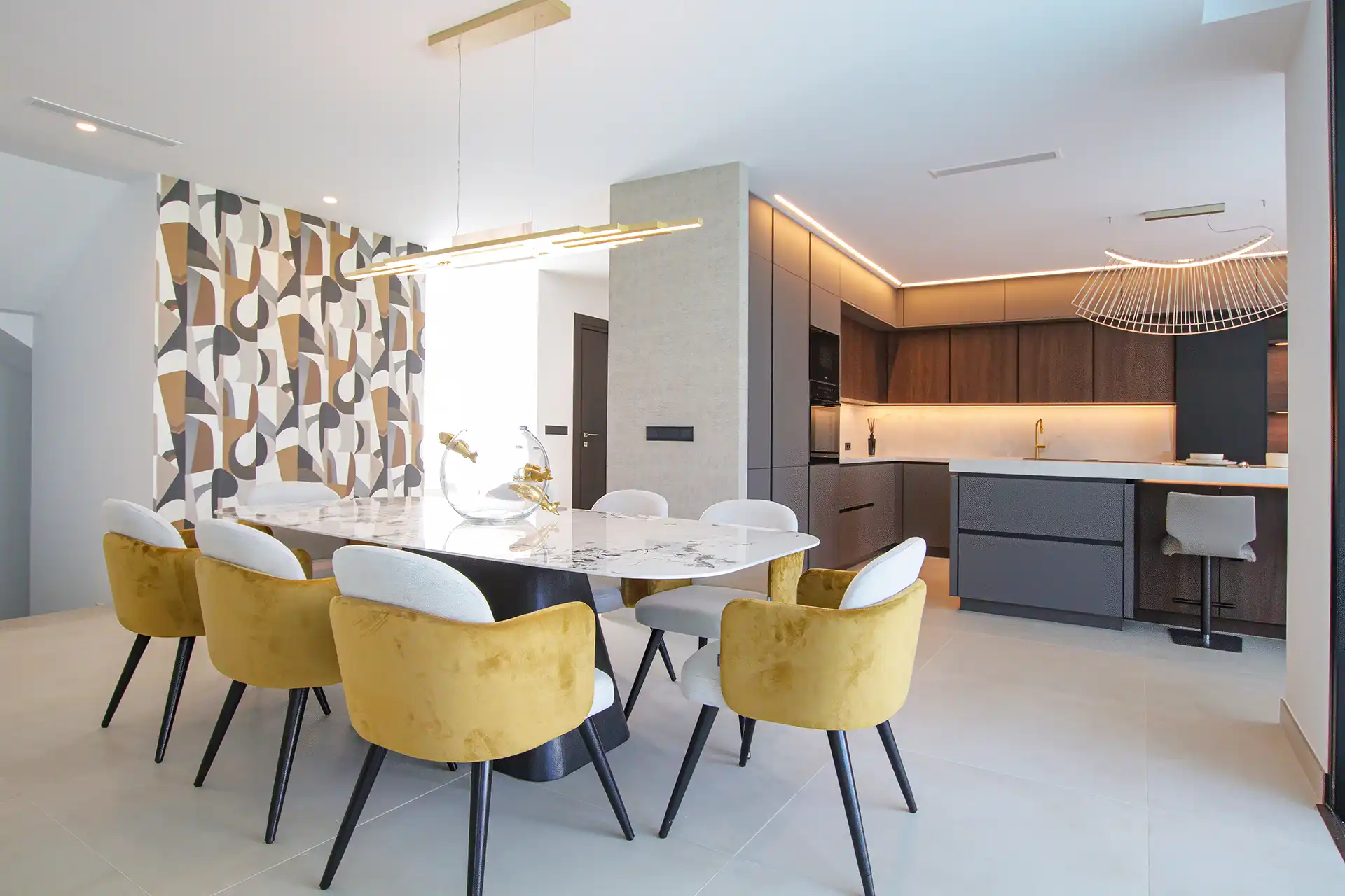 Modern kitchen and dining area with designer furniture in Valle Romano villa.