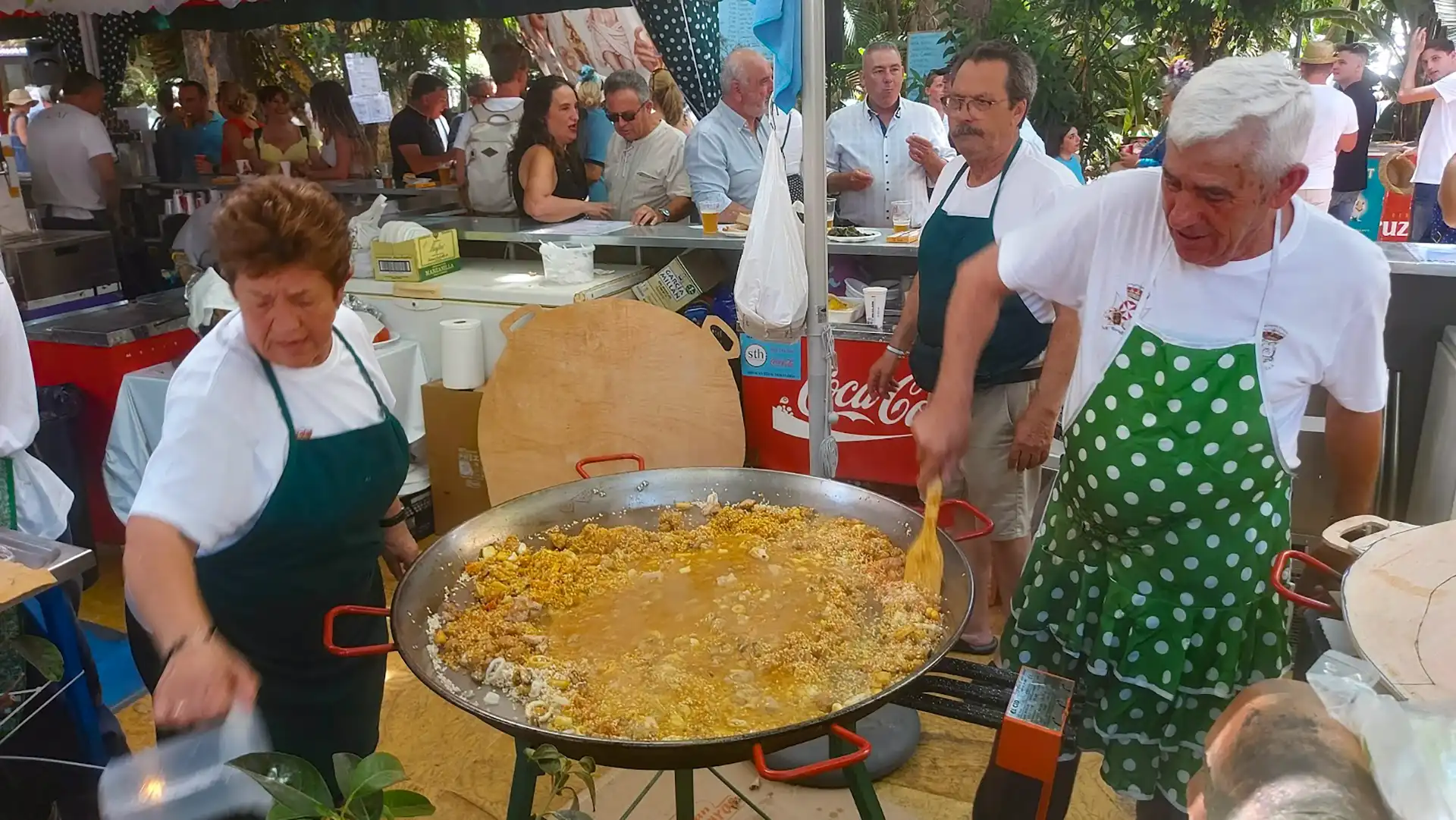 Cooking traditional paella at San Bernabe Marbella festival food stall