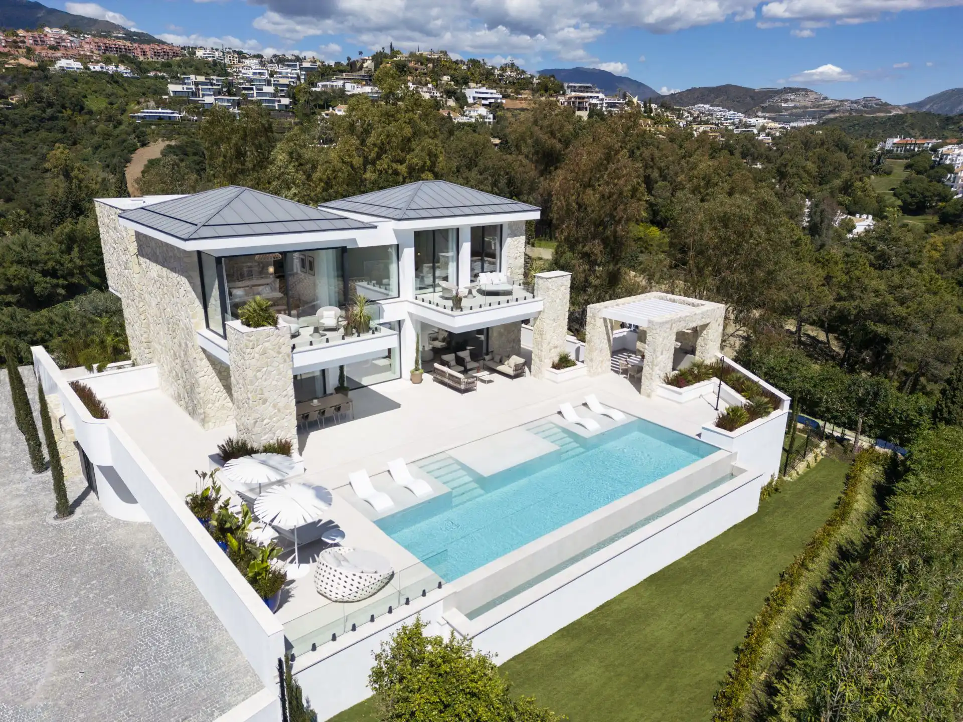 Aerial view of Villa Tiza luxury villa with pool and terraces in Marbella