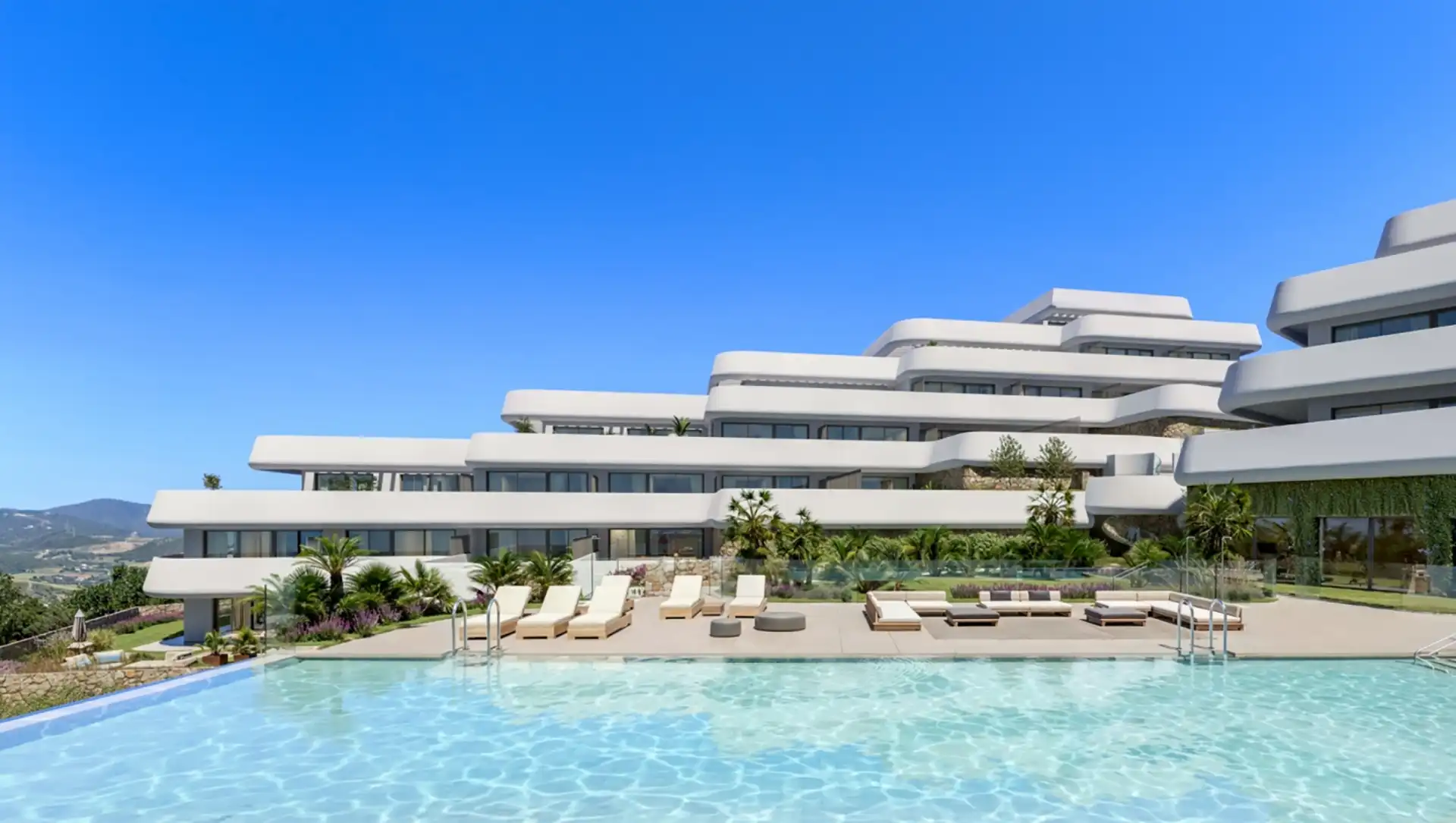 Infinity pool and modern architecture at Skye Casares Golf with sun loungers and gardens