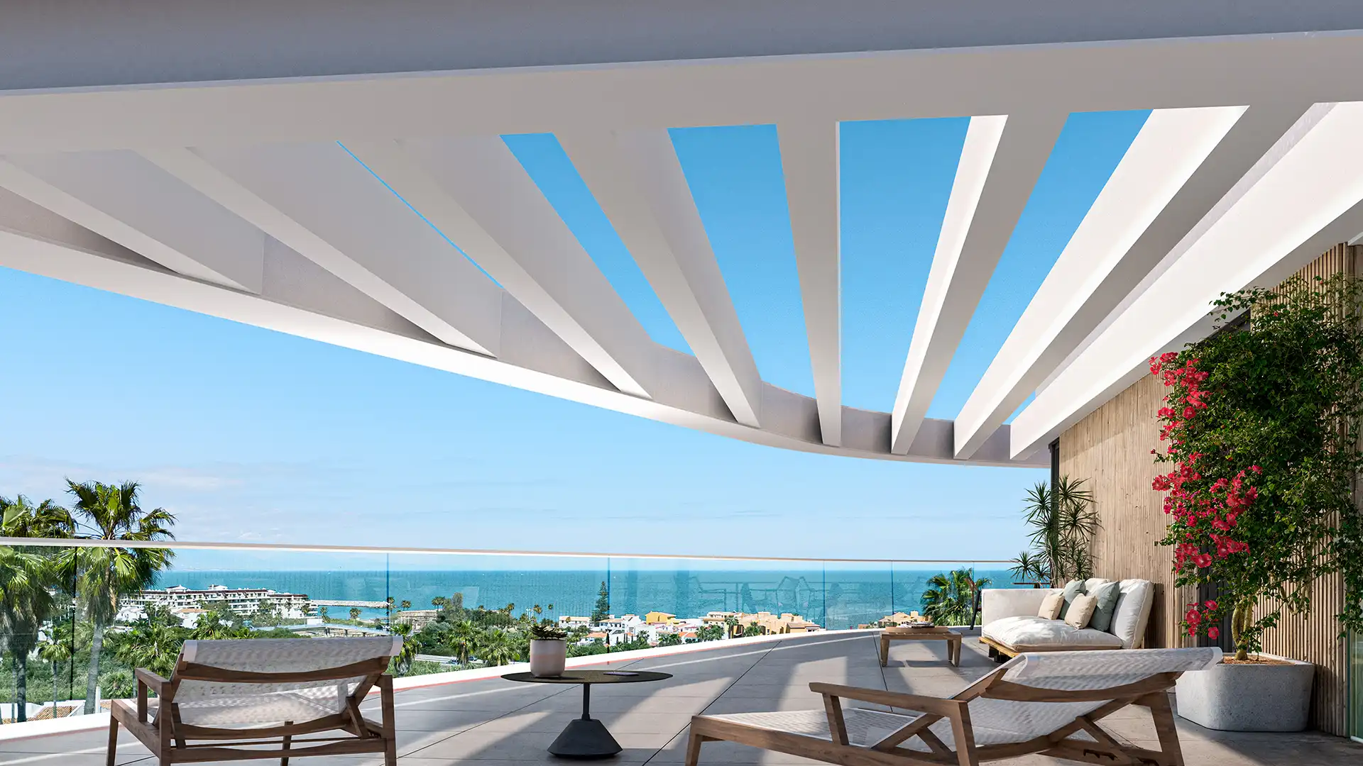 Contemporary terrace featuring seating and a view of the ocean under a geometric roof structure.
