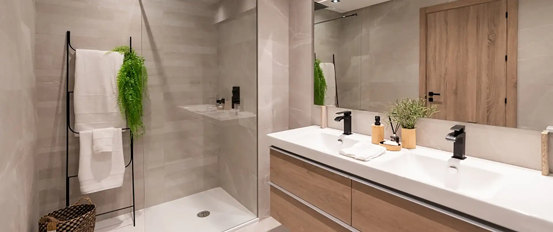 Modern spa-quality bathroom with double vanity and walk-in shower at Almazara Gardens Istán luxury development