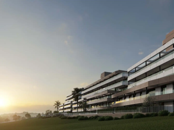 Contemporary multi-story apartment building with horizontal terraces and glass balconies at golden hour sunset