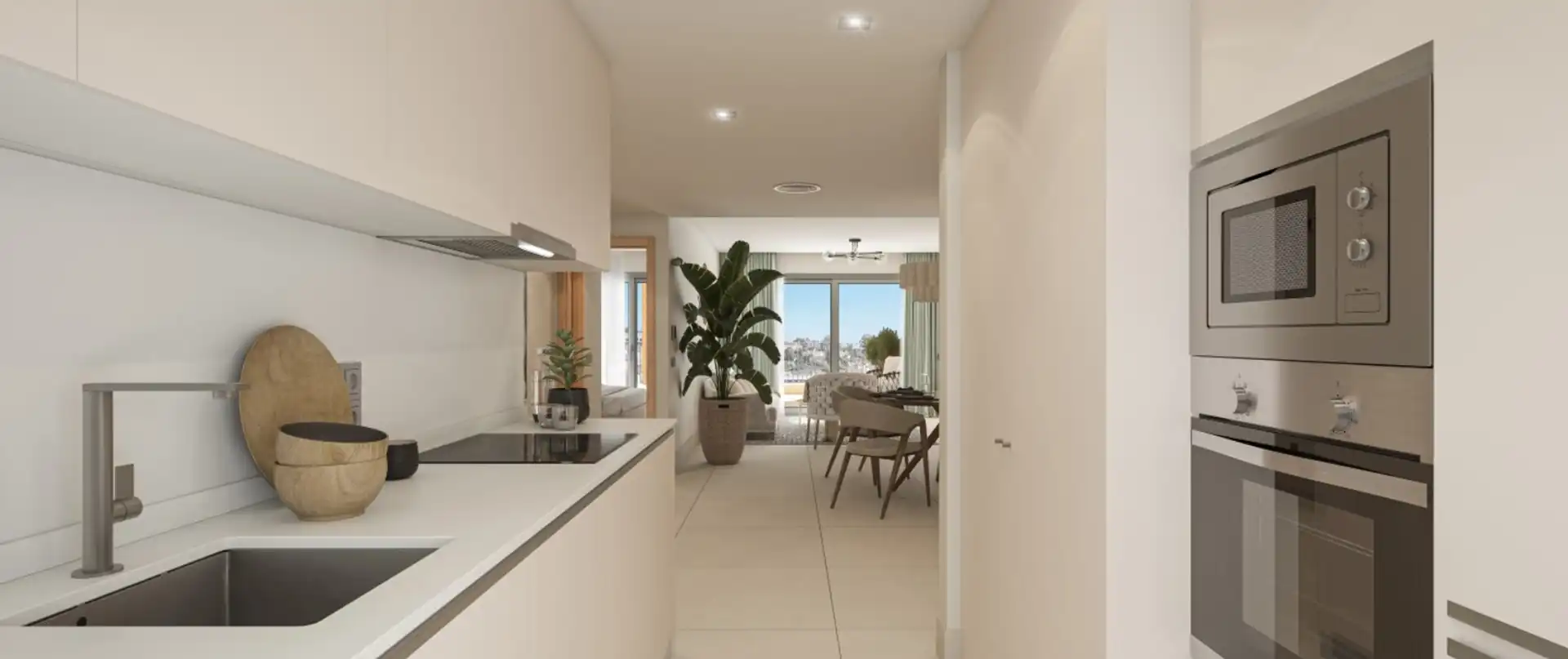 Modern open-plan kitchen with integrated appliances and sea views in Manilva