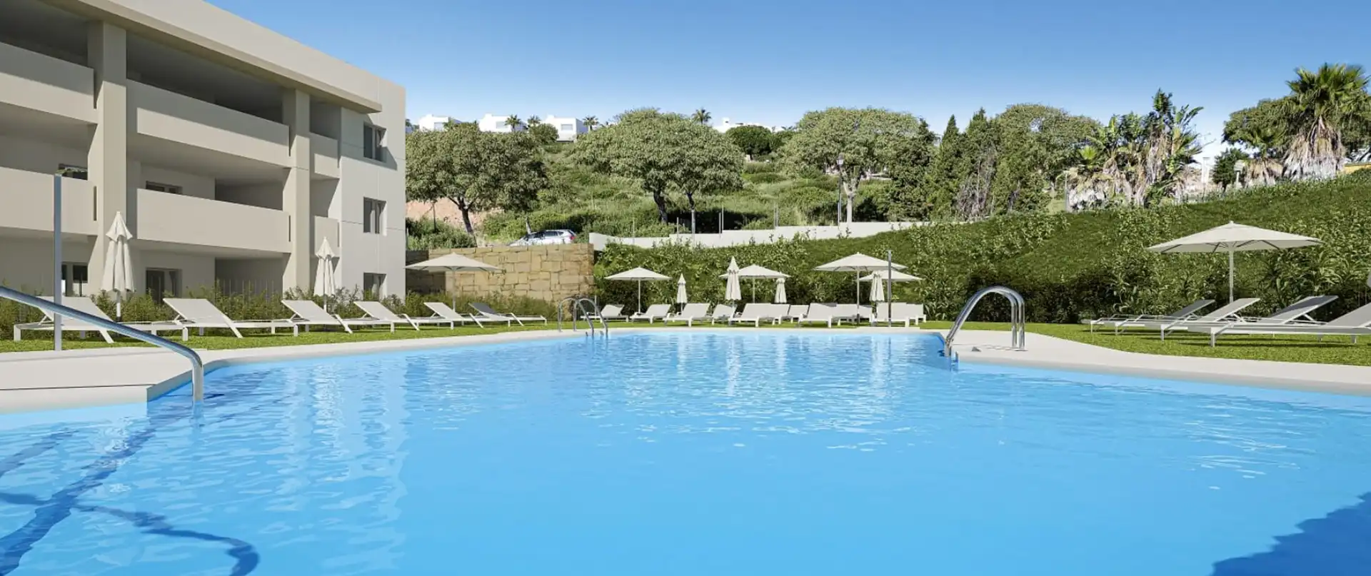 Aerial view of modern hotel-style complex with large swimming pool in Manilva