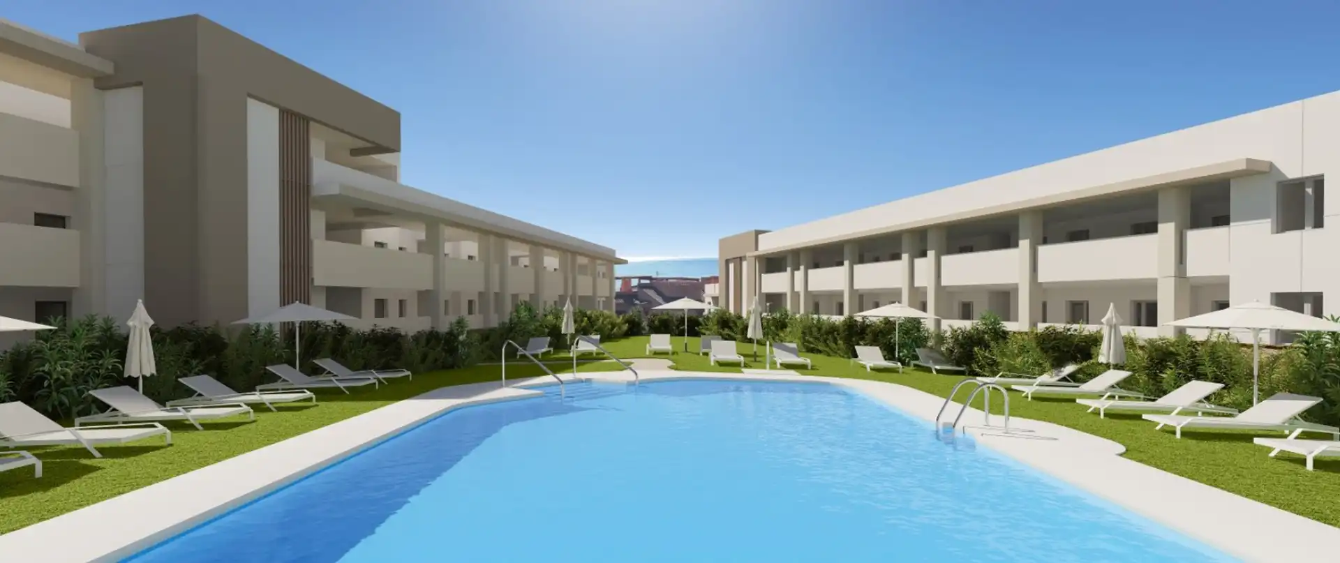 Modern apartment complex with central swimming pool and landscaped gardens in Manilva