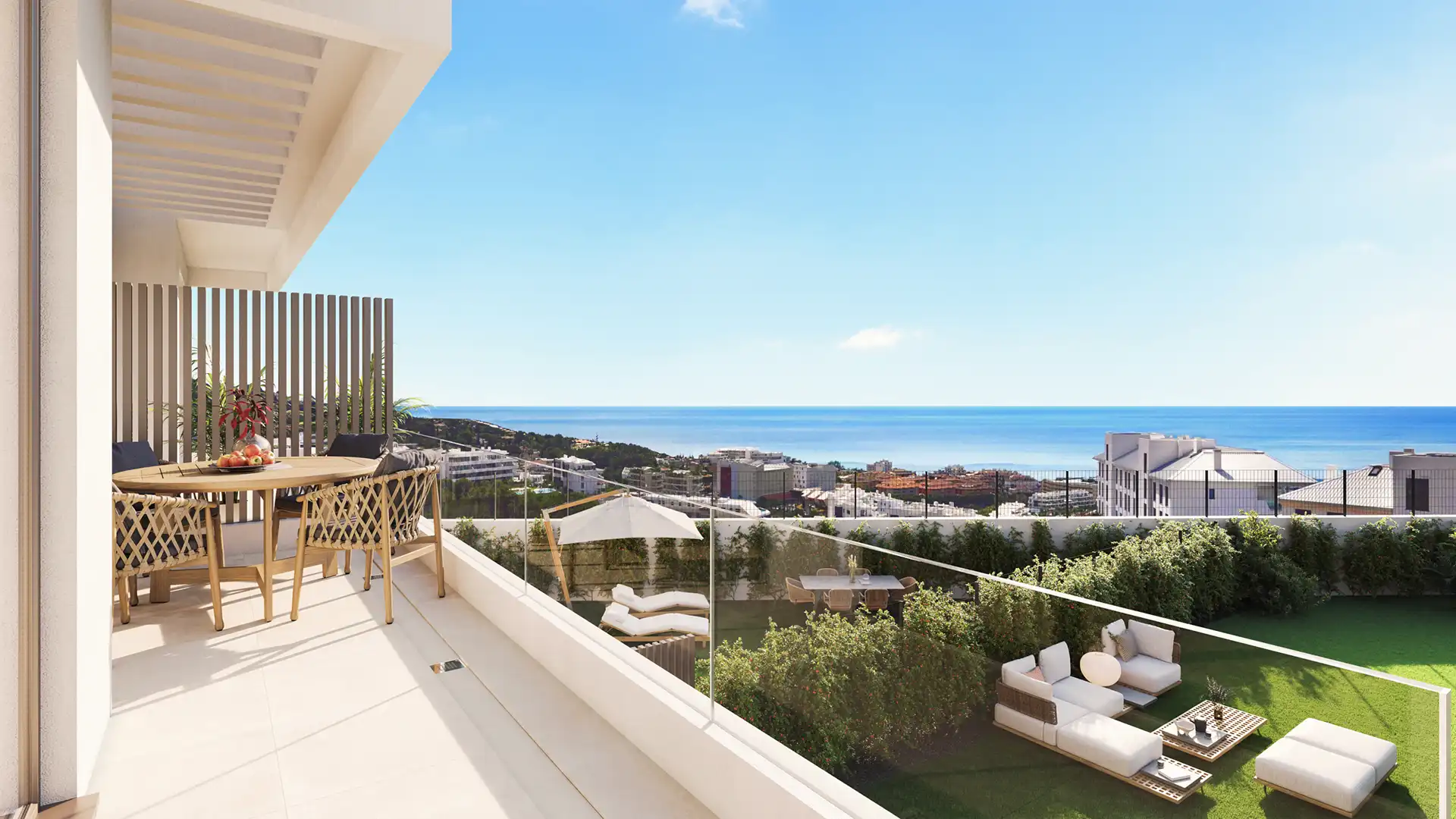 Modern coastal apartment terrace with sea views and outdoor dining area in Fuengirola