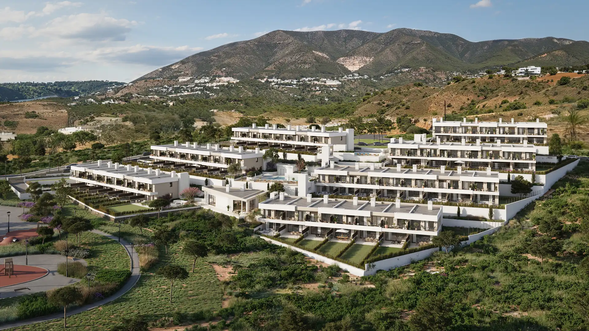 Modern terraced apartment complex with mountain views at twilight in Fuengirola