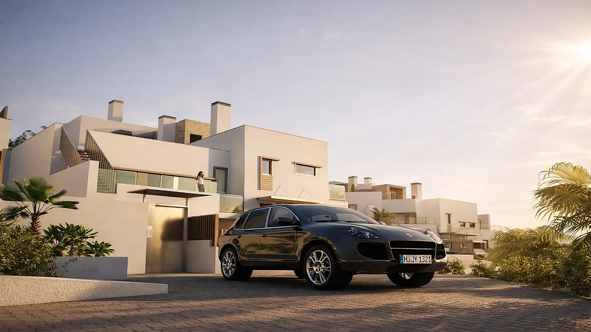 Modern townhouse development with private parking at sunset