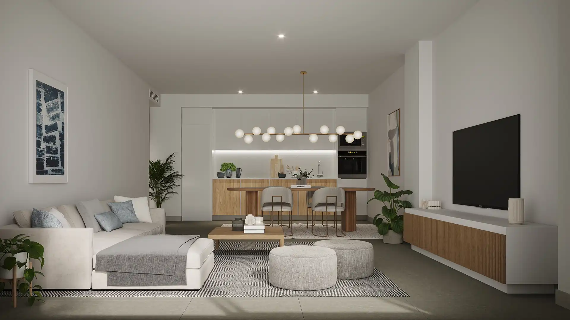 Open-plan living room and kitchen interior with natural light in Mijas Costa apartment