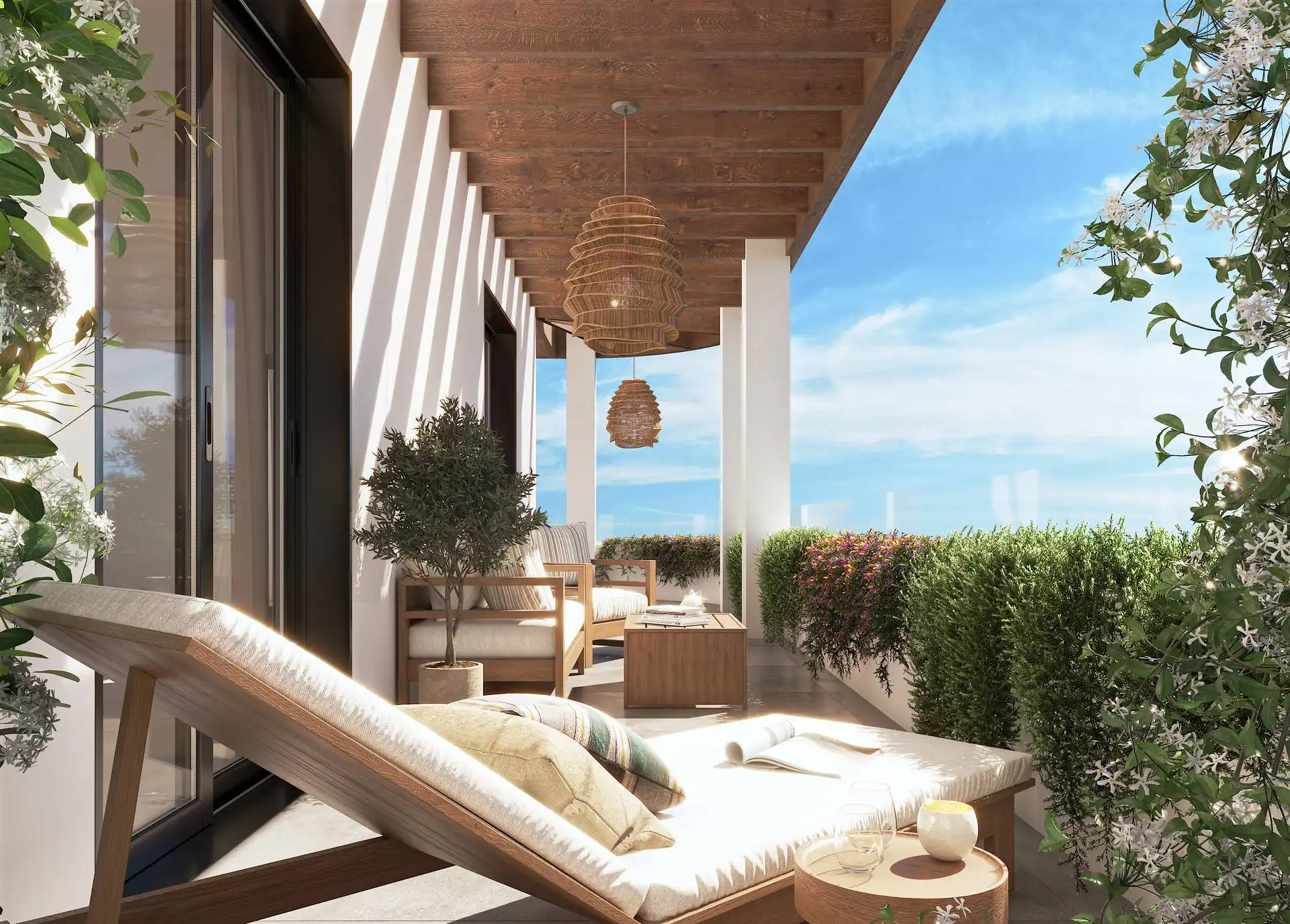 Covered terrace with teak sunlounger and sea views