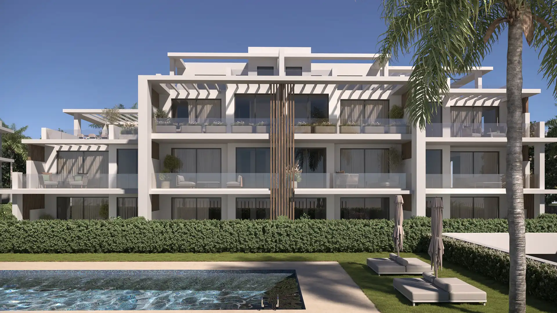 Communal swimming pool and landscaped gardens in a gated Estepona community