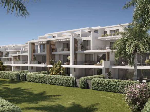 Royal Park Estepona contemporary white apartment complex with wood-clad balconies, lush gardens, and palm trees under blue sky