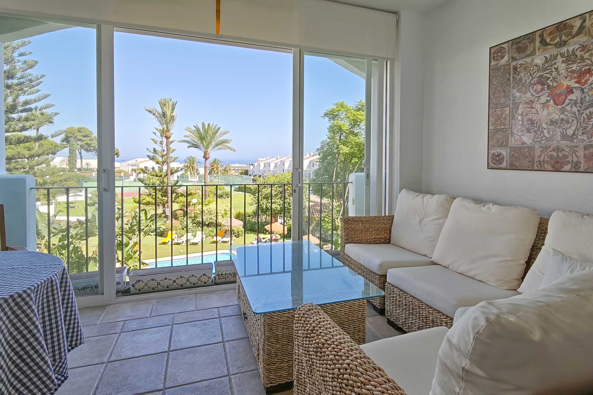 Glazed terrace overlooking gardens and sea, Cerro Blanco Nueva Andalucia