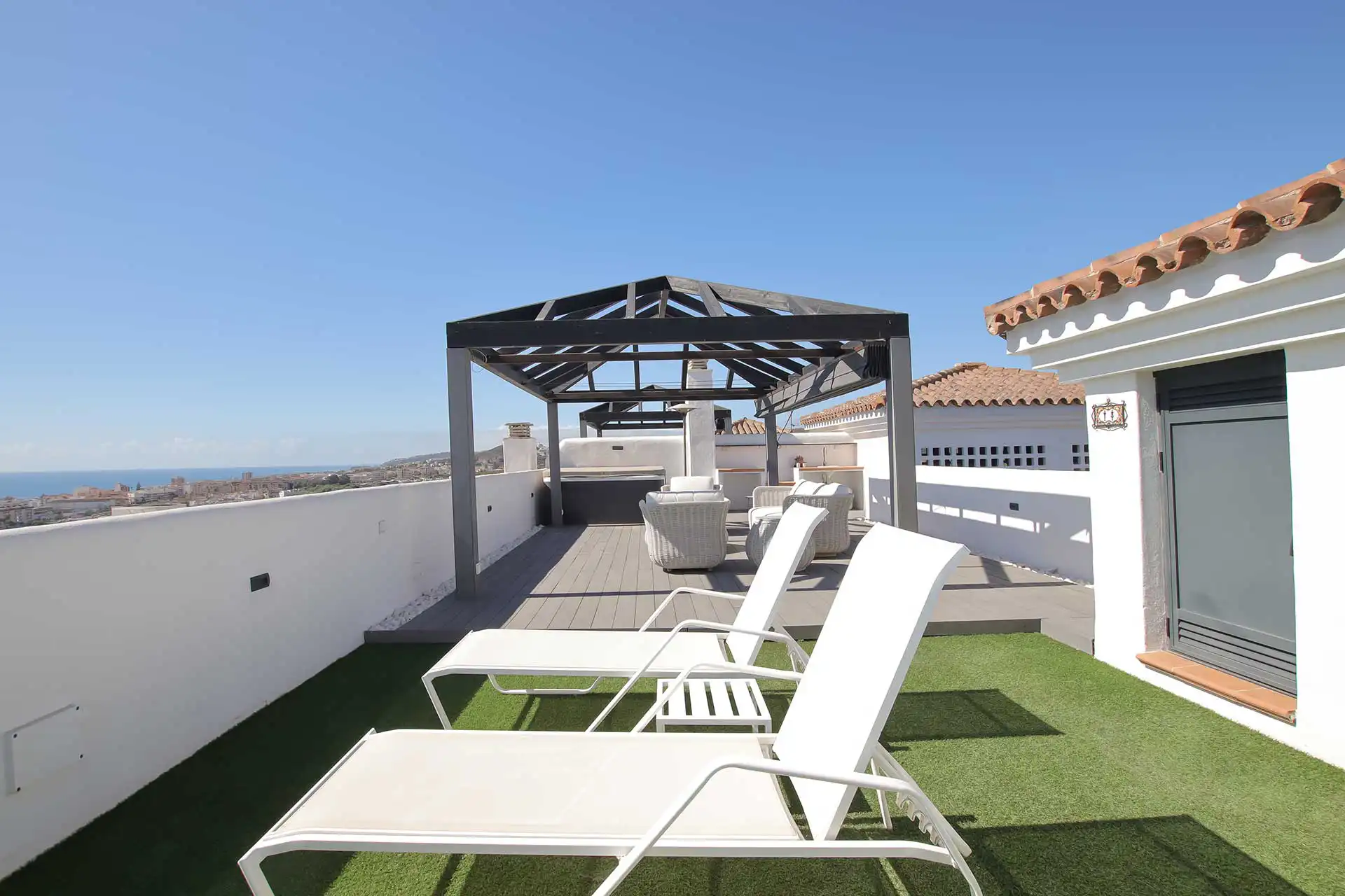 Rooftop solarium with sun loungers and pergola, Lotus Doña Julia penthouse