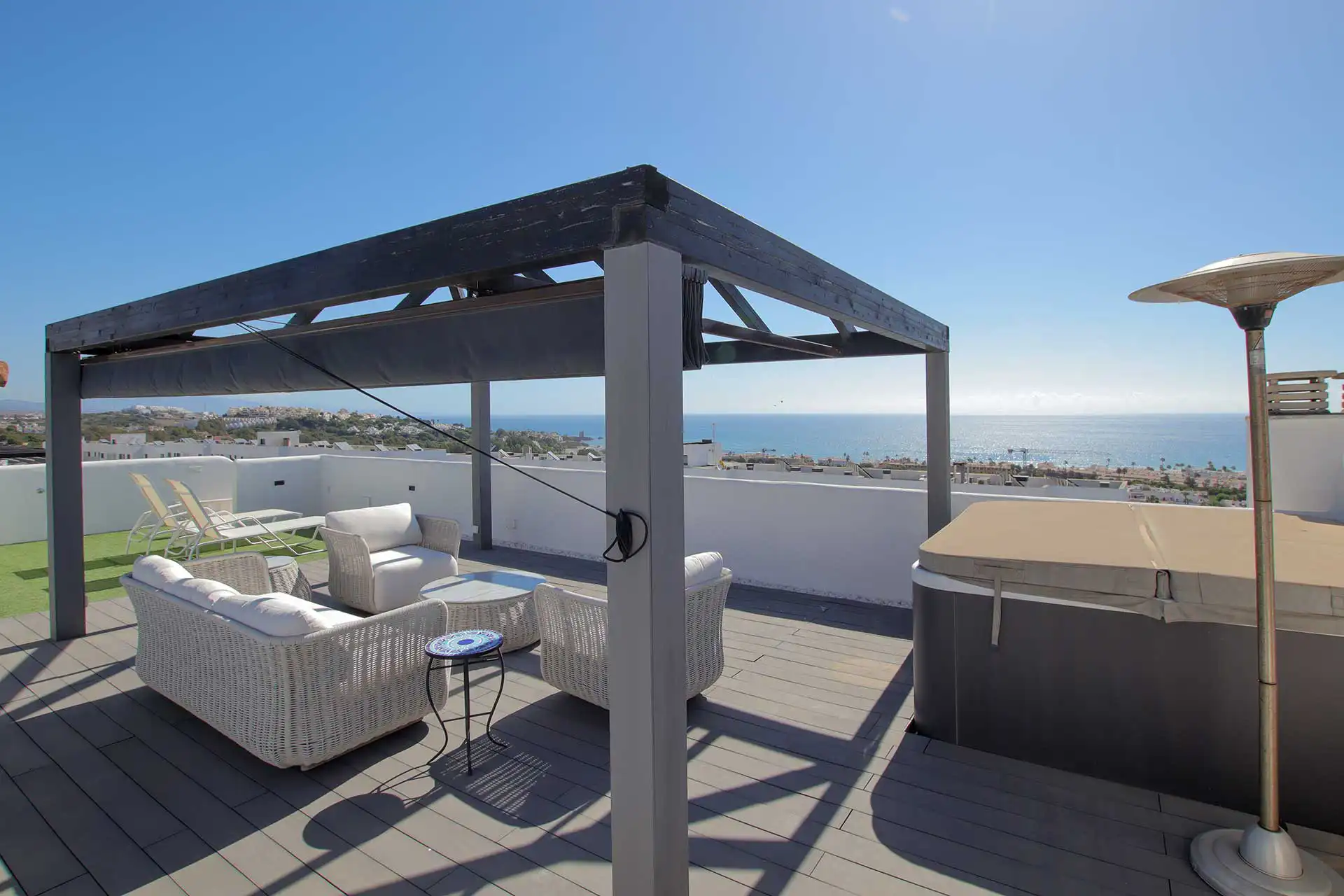 Rooftop solarium lounge with pergola and sea views, Lotus Doña Julia penthouse