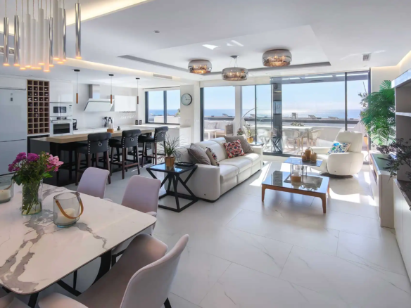 Open-plan living, dining and kitchen with sea views, renovated penthouse in Casares Costa