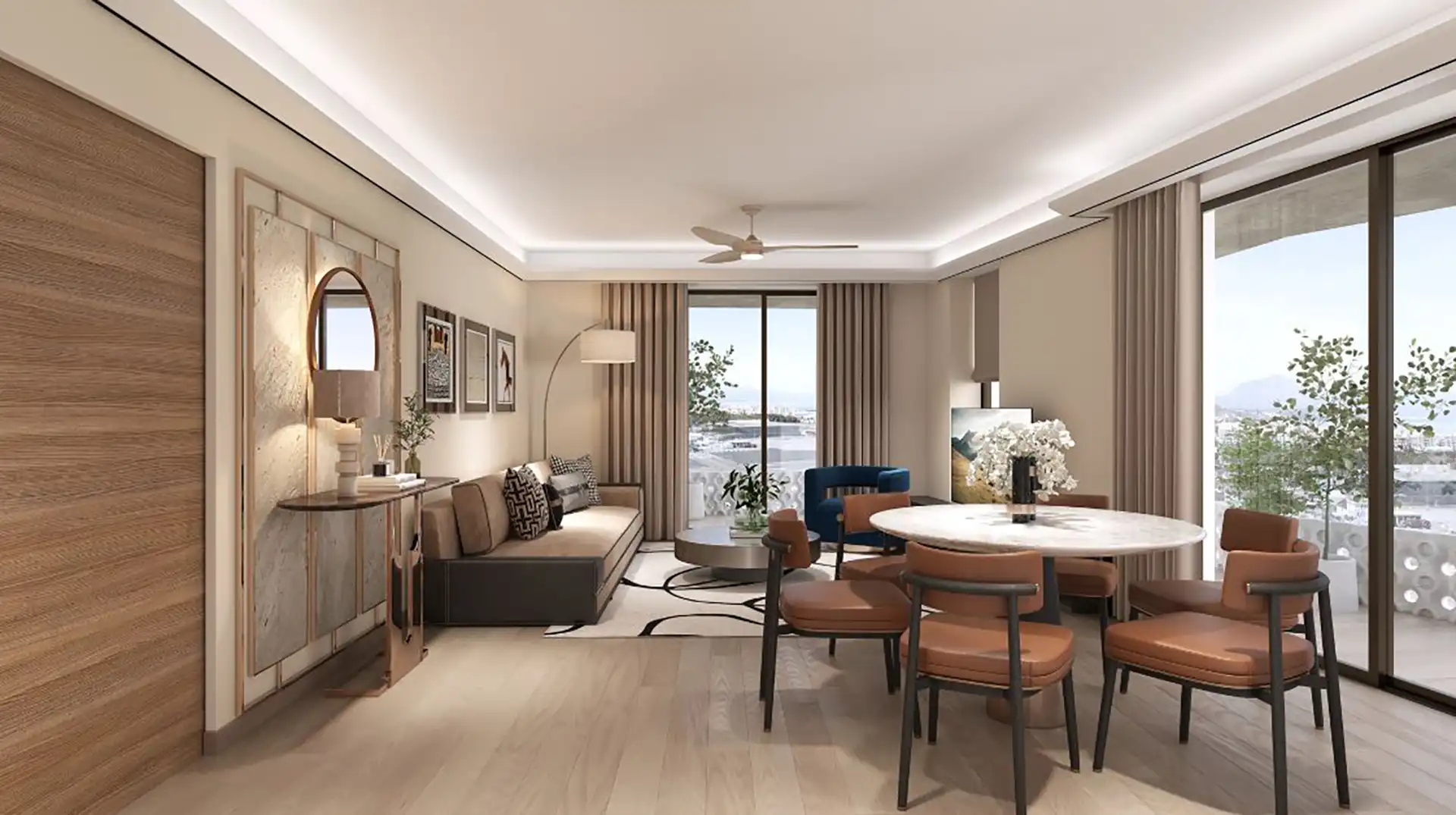 Open-plan living and dining room with marble table and sea views in a new Gibraltar apartment