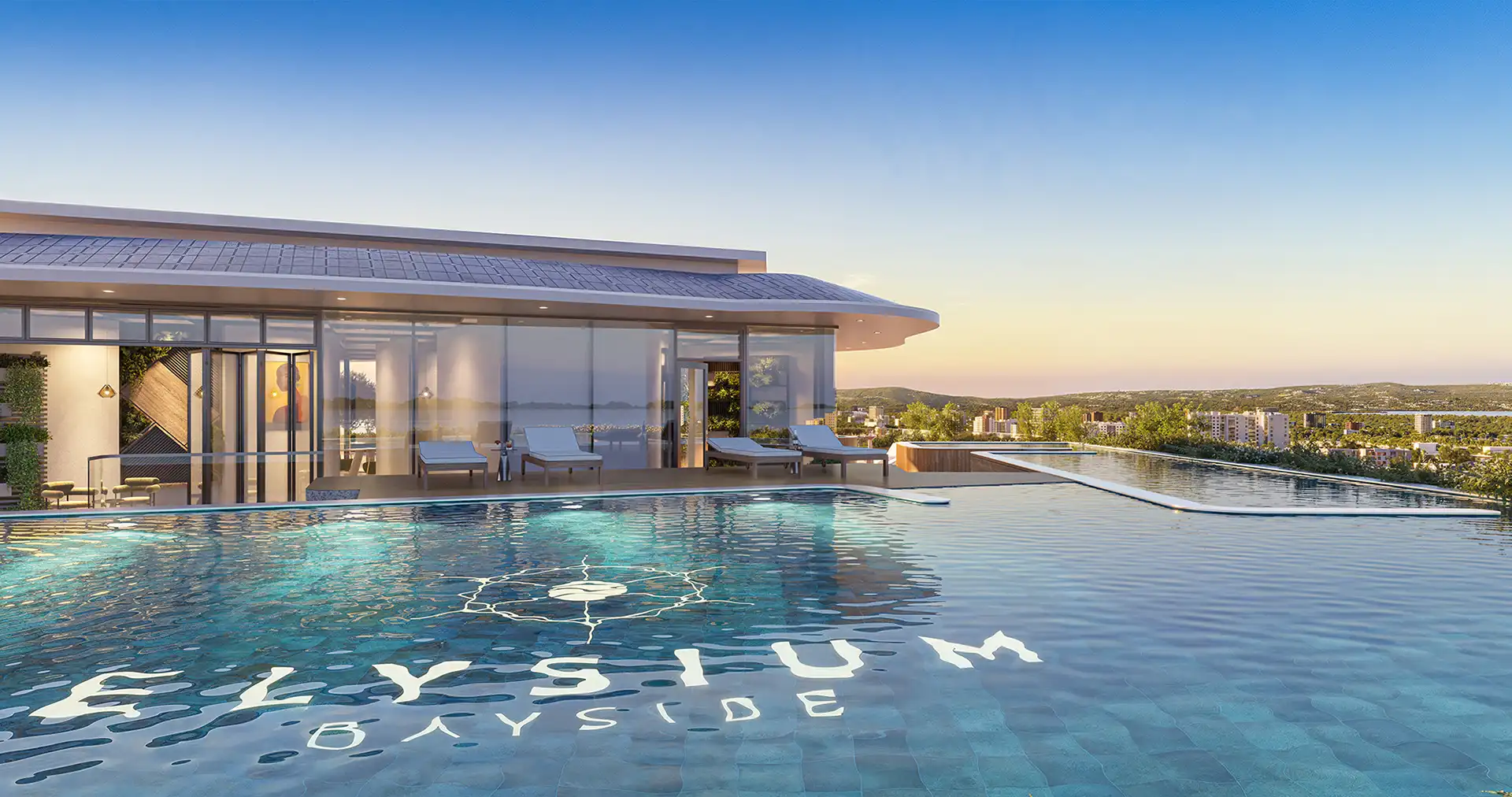 Rooftop infinity pool with mosaic logo at Elysium Bayside, Gibraltar, at sunset