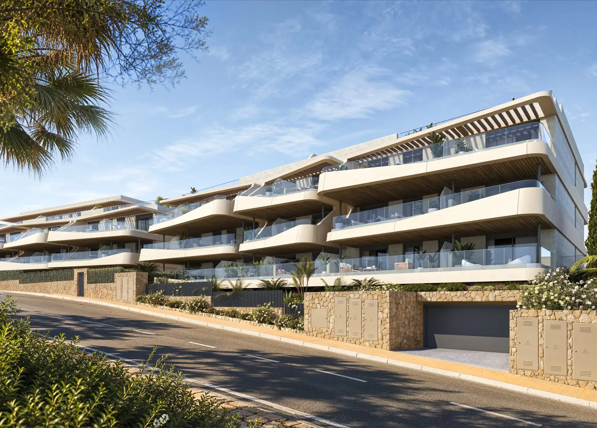 Contemporary apartment blocks with glass-railed terraces and natural stone detailing in West Estepona
