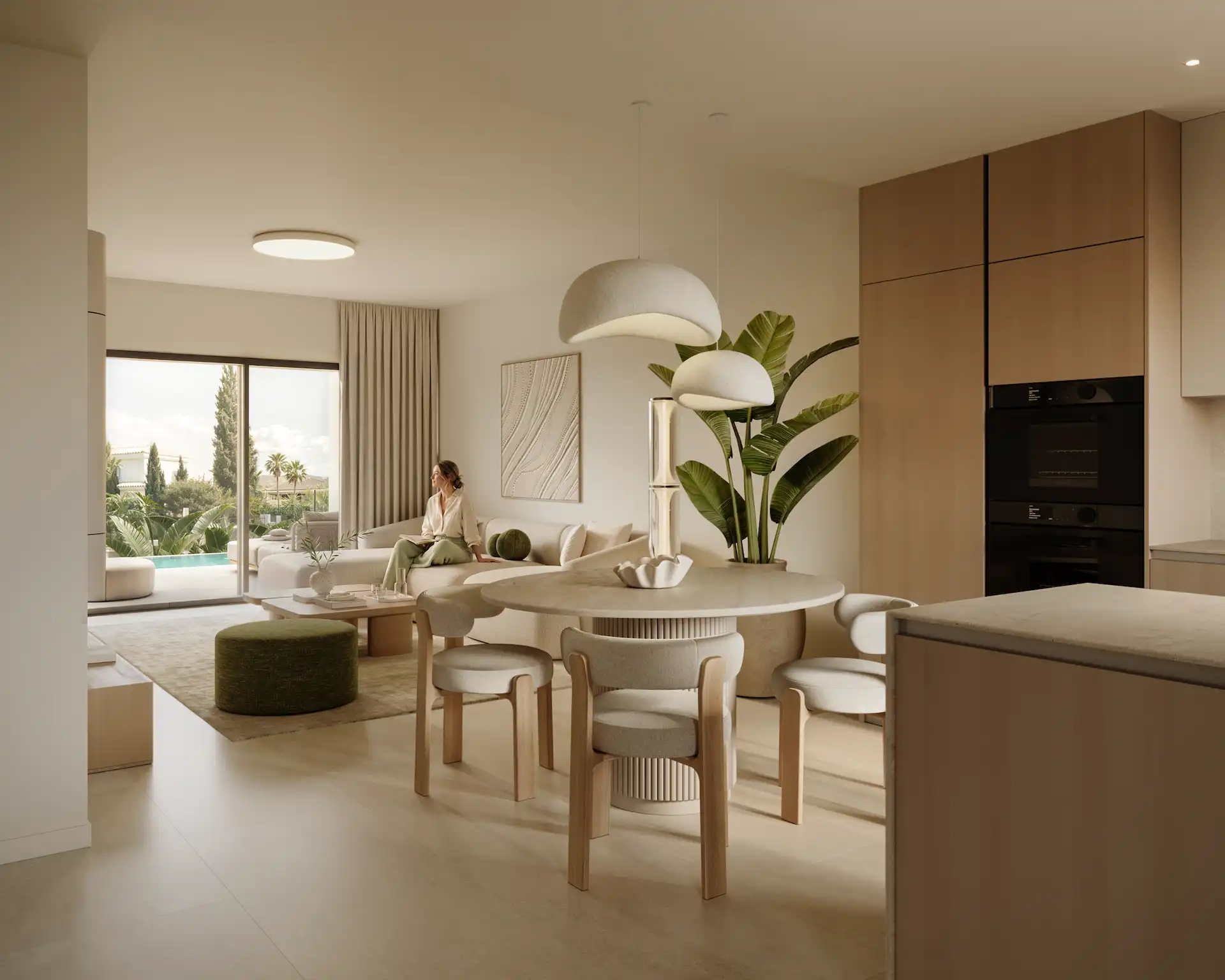 Open-plan living and dining area with pool views in a new Manilva villa