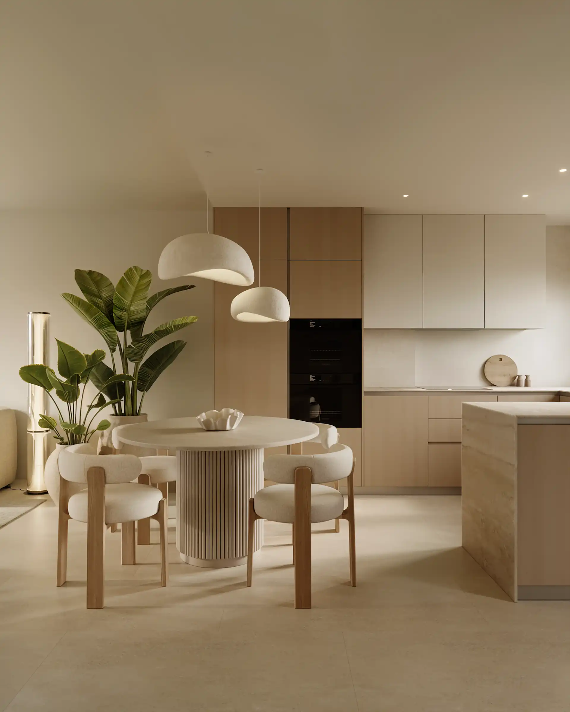 Handleless kitchen and sculptural dining table in warm neutral tones