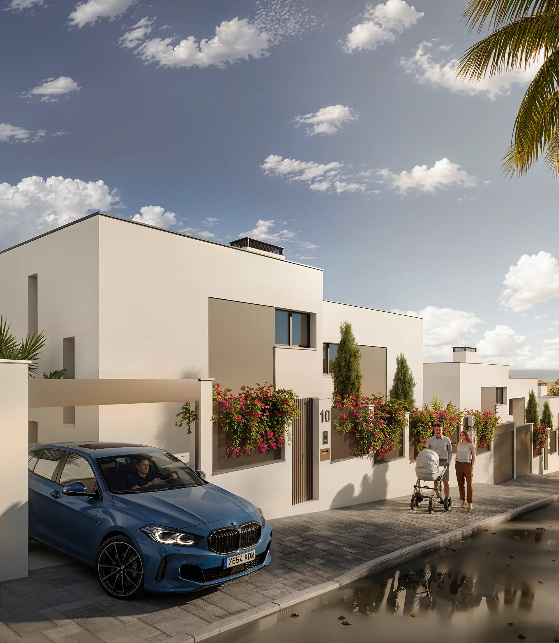 White semi-detached homes with private carports and bougainvillea in Manilva