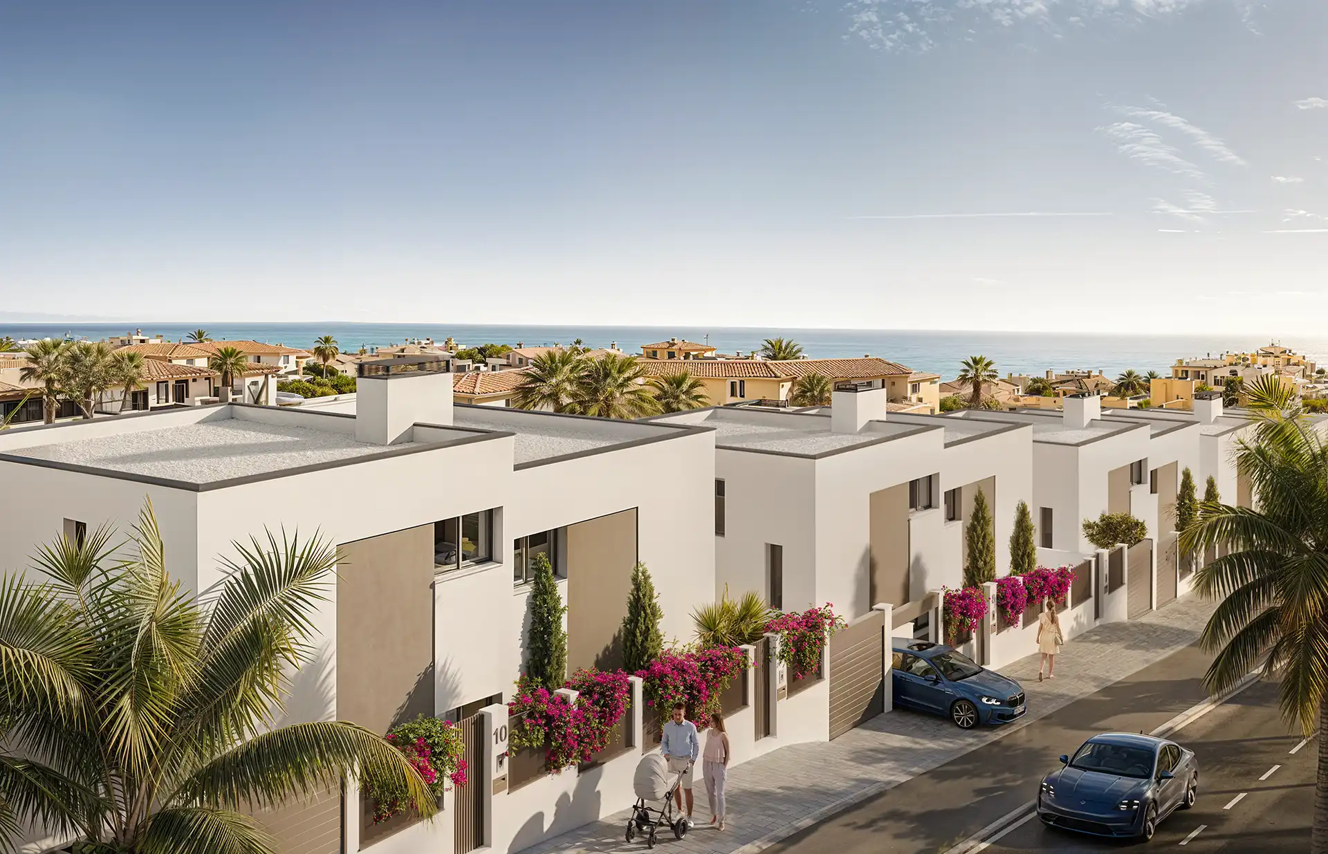 White townhouses with bougainvillea terraces overlooking the Mediterranean in Manilva